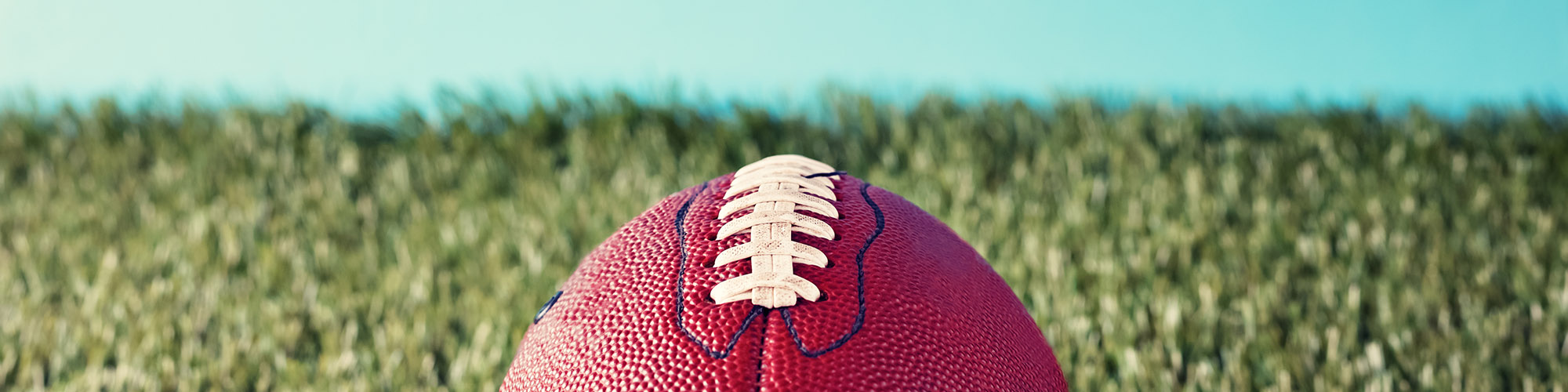 Vintage football over grass