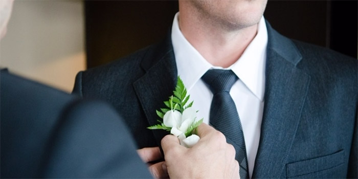 groom and boutonniere green wedding