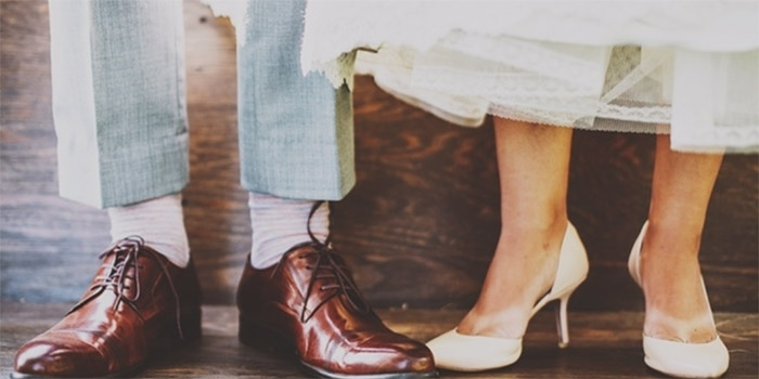 bride and groom feet green wedding