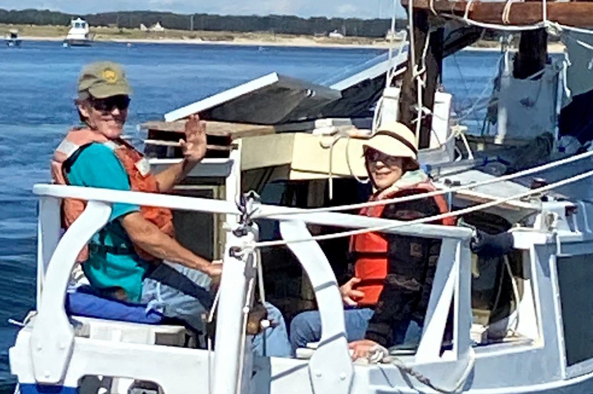 couple on sail boat