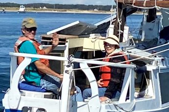 couple on sail boat