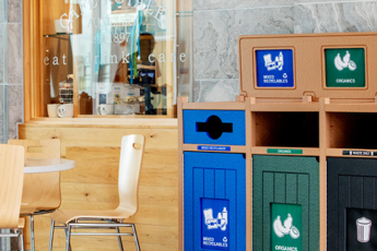 Aspyre triple bins above bin signage