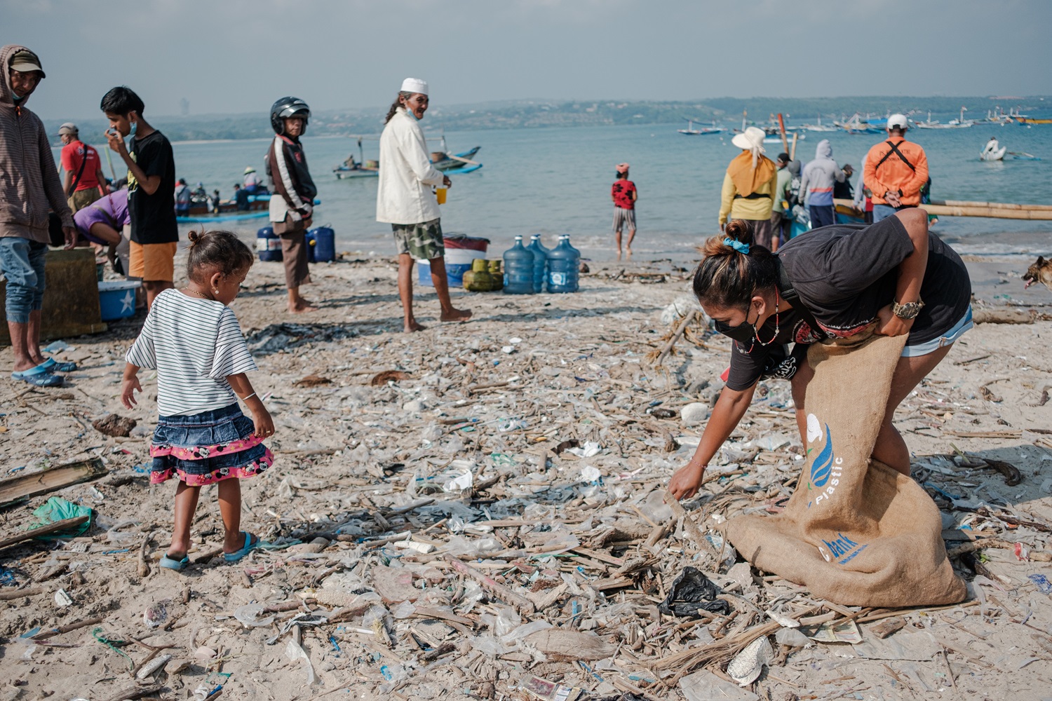 Ika Somawati collects plastic at Kuta Beach, Badung, Bali. Photo courtesy of Plastic Bank. 