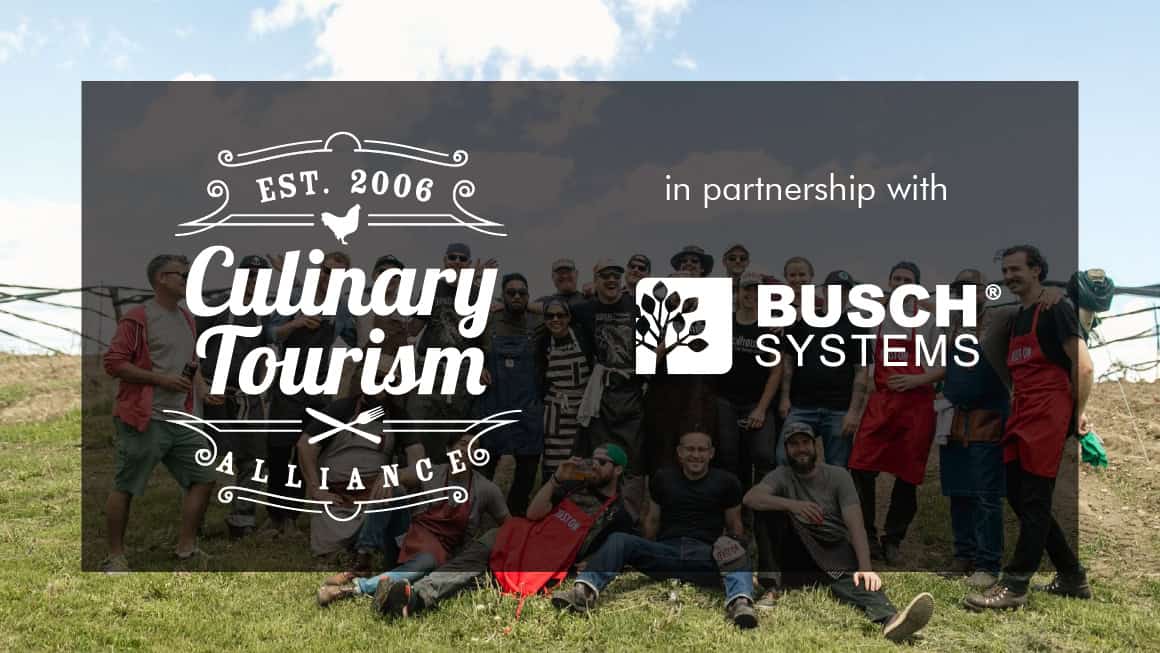 Culinary Tourism and Busch Systems logo in front of a group of people