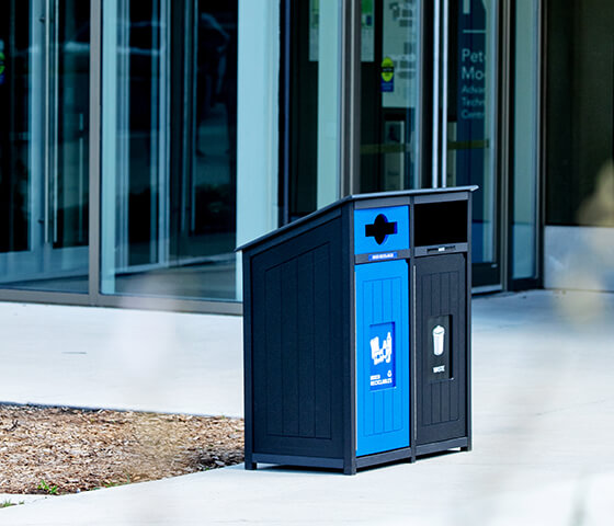 Busch Systems Aspyre Collection Aura Series double in black and blue at a municipal building entrance outside