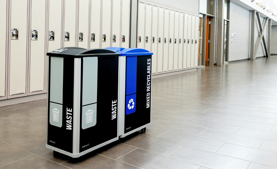 Mosaic Series mixed recyclables and waste containers with custom signs and labels in college hallway