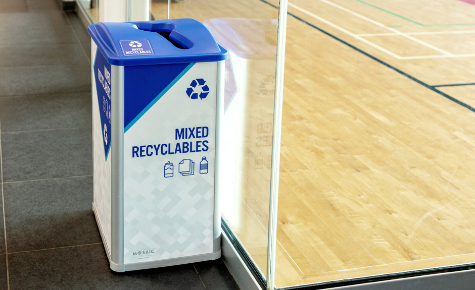 Mosaic Series mixed recyclables container with custom signs and label in community sports center