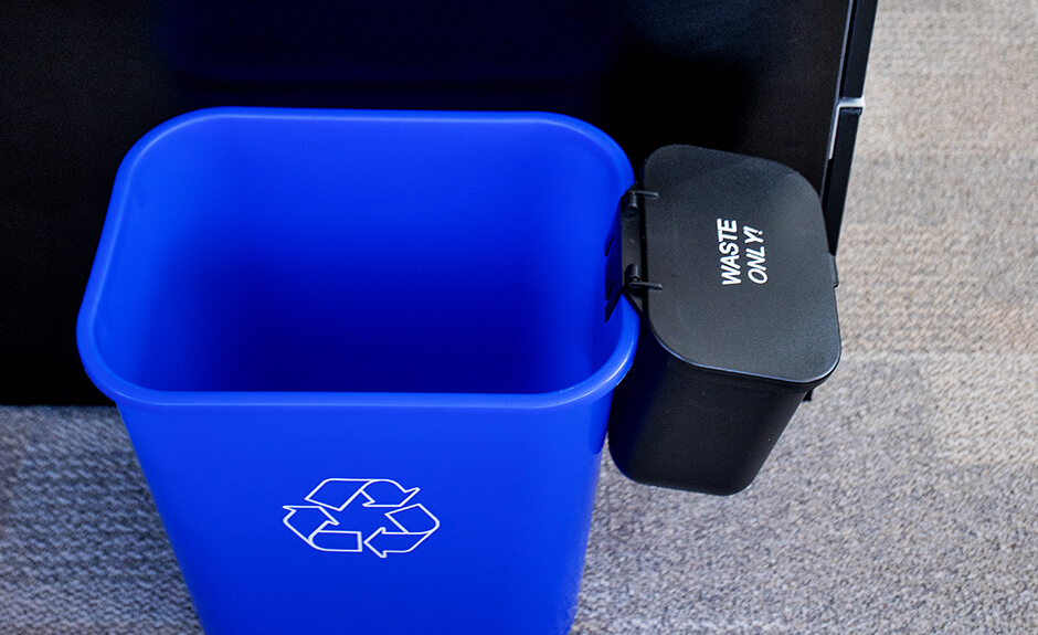 Busch Systems blue Recycling basket with mobius loop symbol and black hanging waste basket attached