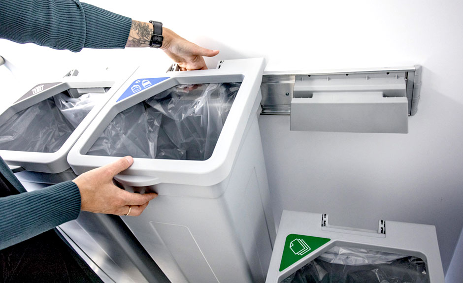  cans and bottles and paper lid labels in office environment with lid open