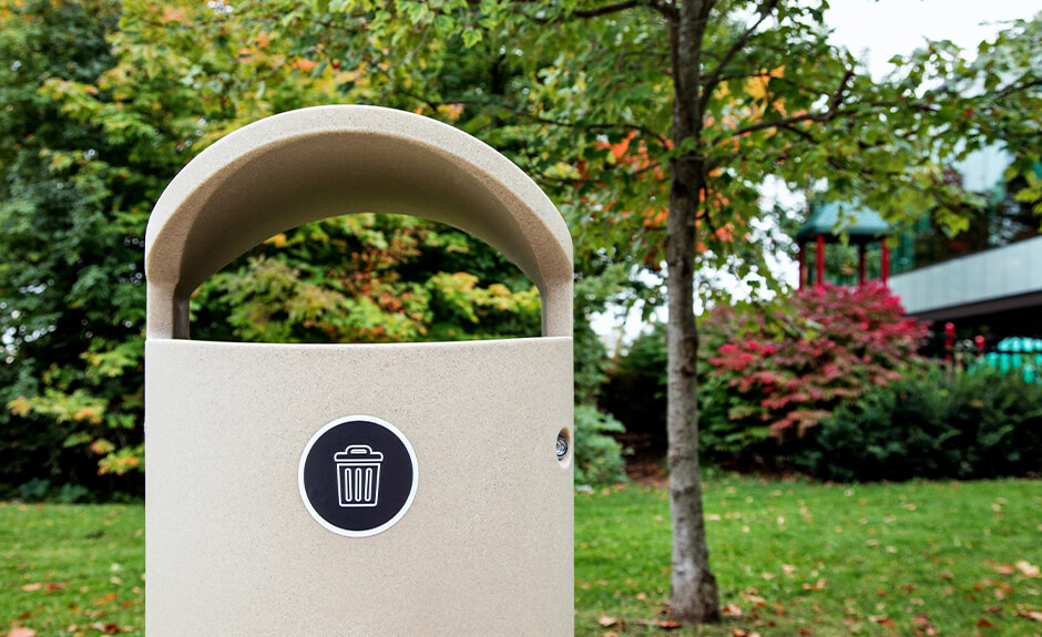 Busch Systems Euro Series single stream waste container in sandstone with trash graphic