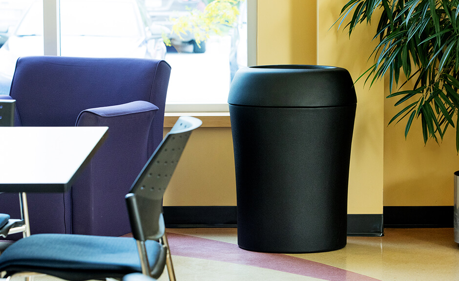Busch Systems Infinite container in black with full open lid in an office