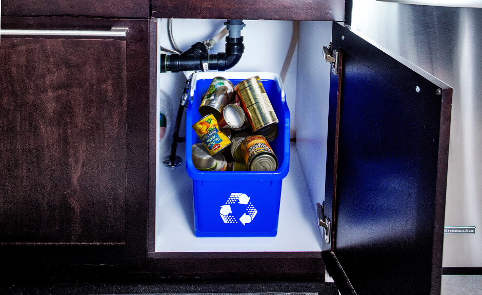 Green Busch Systems Multi Recycler container with a mobius loop graphic on a kitchen counter