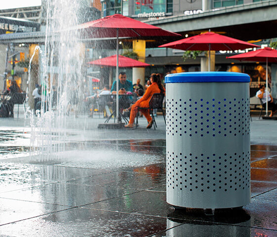 Busch Systems Portland single container with blue full open lid secured to the ground