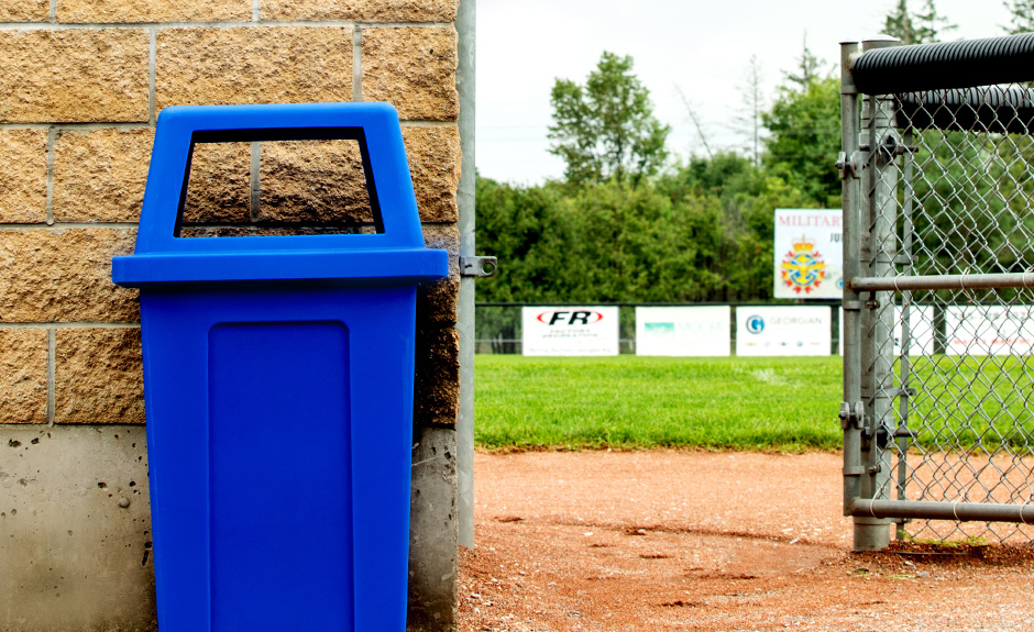 Busch Systems blue Sentry single bin at a baseball diamond