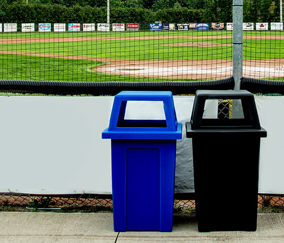 Two Busch Systems Sentry bins side by side in blue and black at a sports complex