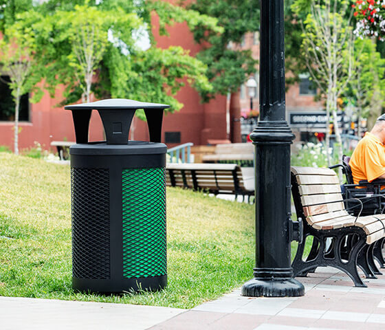 Busch Systems Toronto container with green and black liners showing through mesh-like exterior and black canopy lid