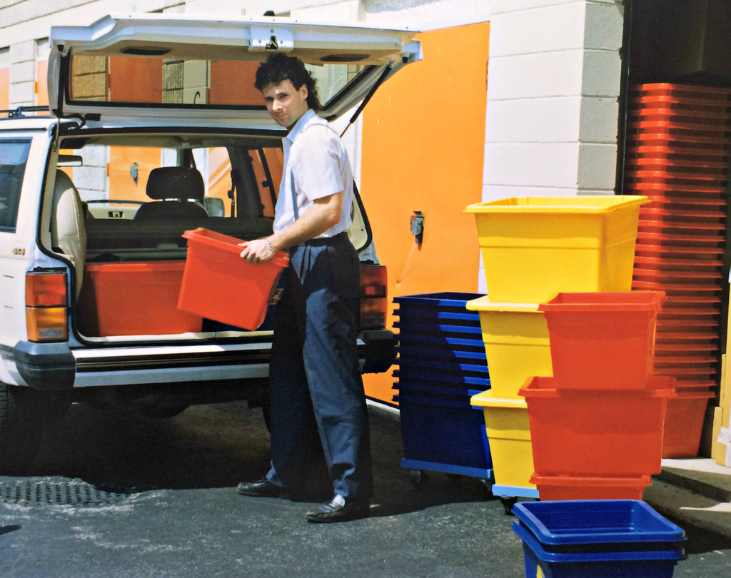 Craig Busch loading car with curbside recycling bins