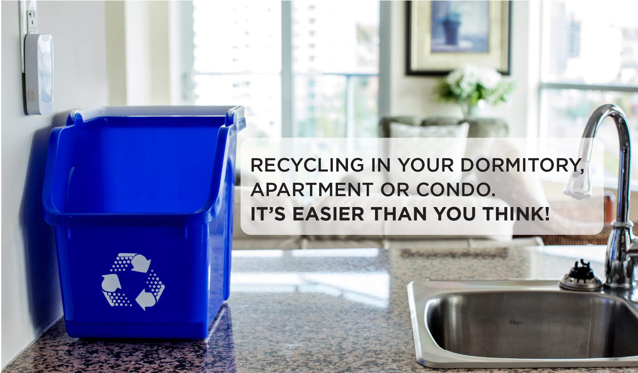 Blue countertop recycling container beside a sink