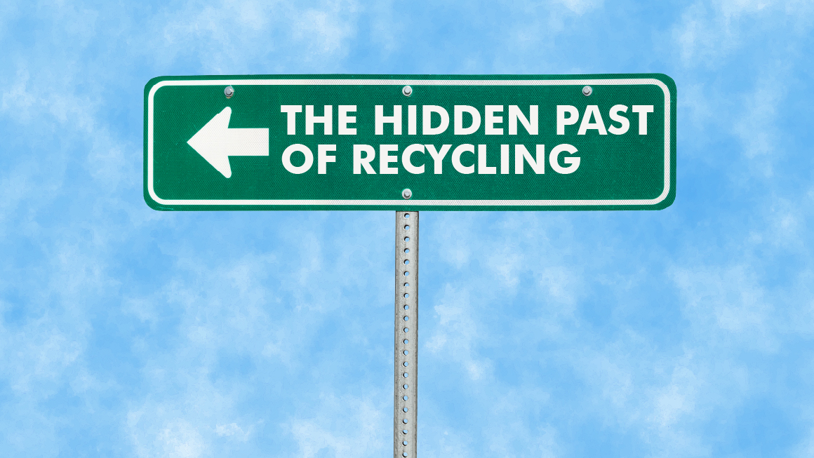 A green road sign with a white left arrow and text that reads THE HIDDEN PAST OF RECYCLING against a blue sky with light clouds.