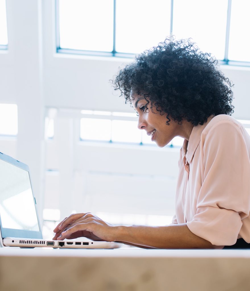 woman staring at her laptop