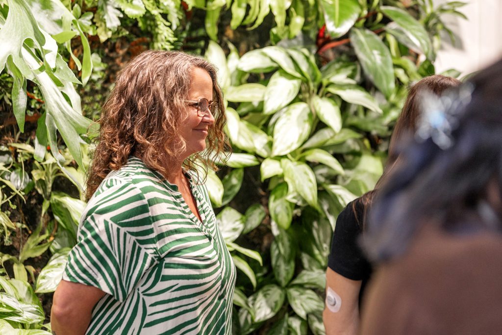 woman with a bushes background