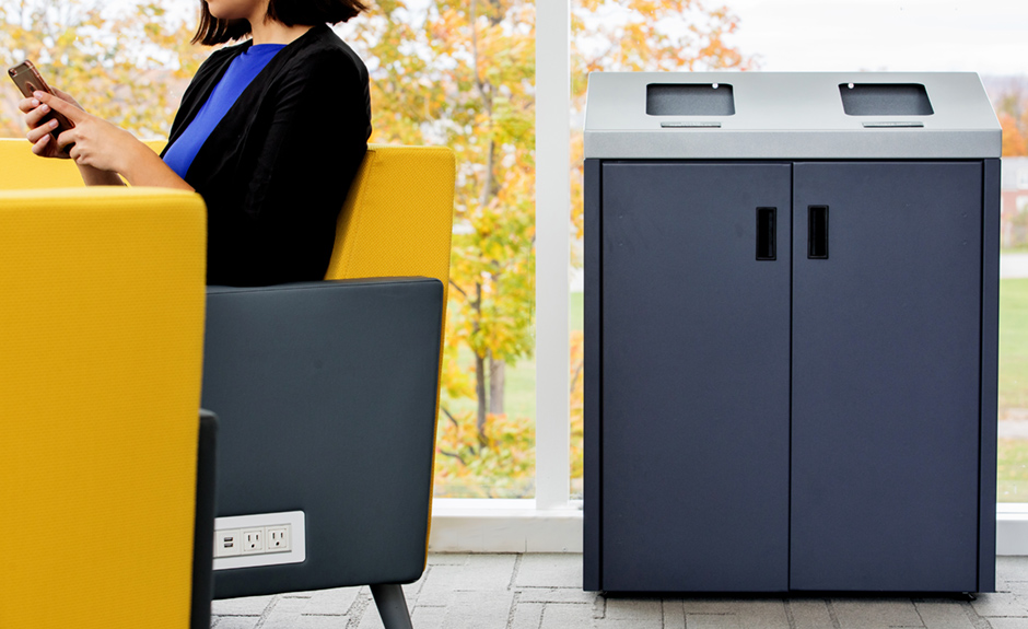 waster sorter bin next to a woman